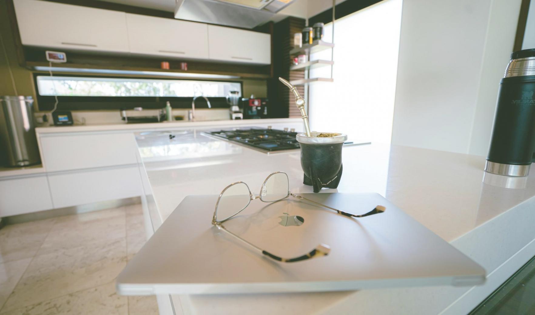 Professional workspace with financial planning materials and laptop showing budget tracking